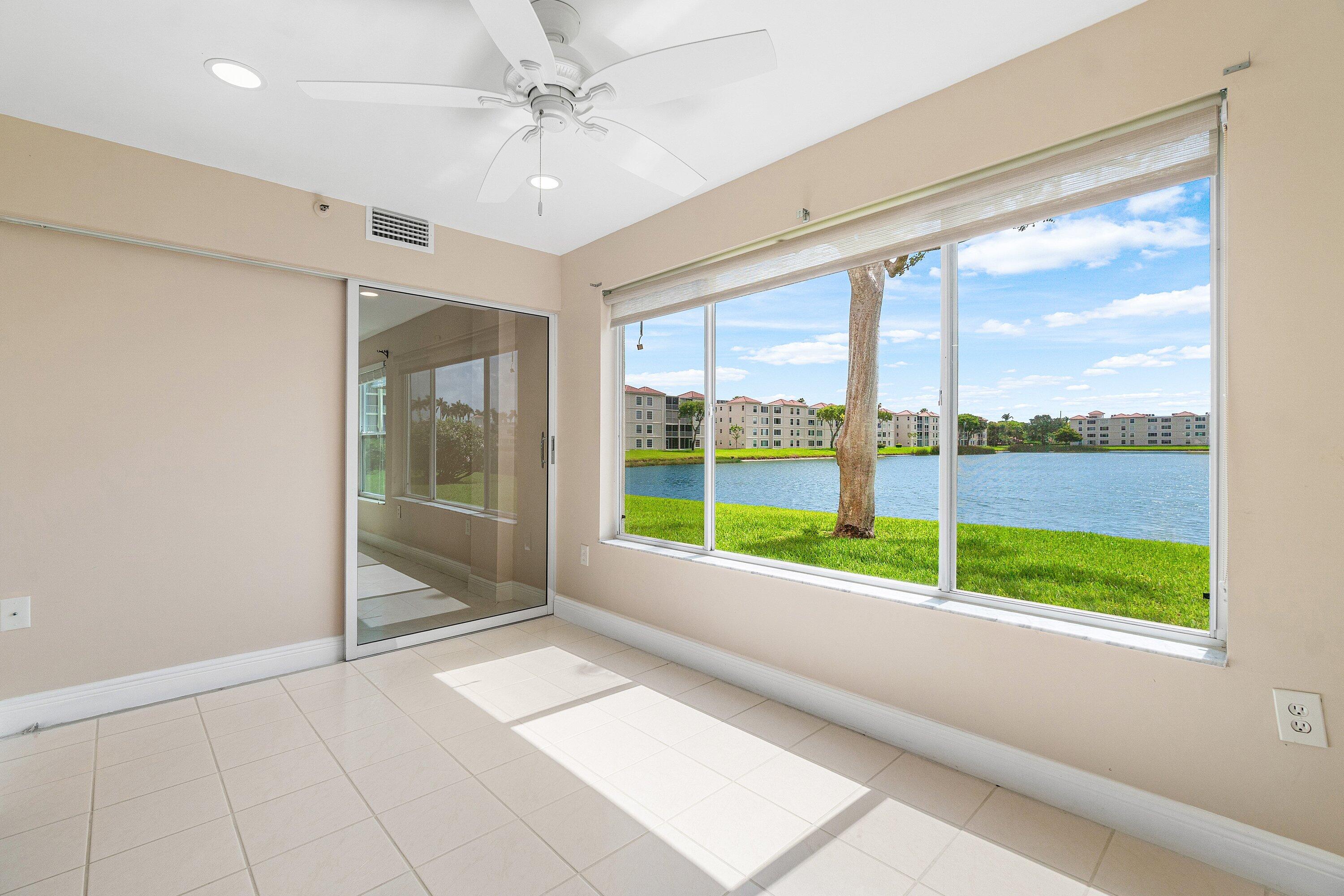 14096 Huntington Pointe Drive, Unit 106 Delray Beach, FL 33484 - Photo 29 of 47 a view of an empty room with a large window