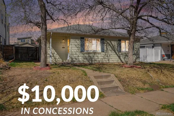 a view of a house with yard and tree s