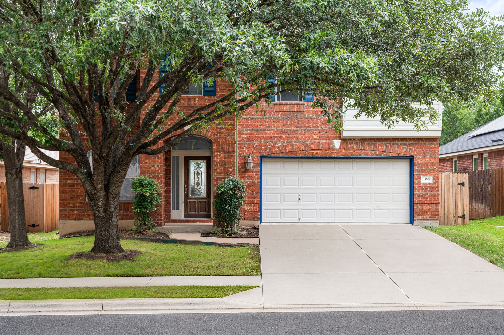10004 Isle Royale Way Austin, TX 78747 - Photo 2 of 31 A classic brick exterior offers timeless appeal with a welcoming entry and convenient attached garage.