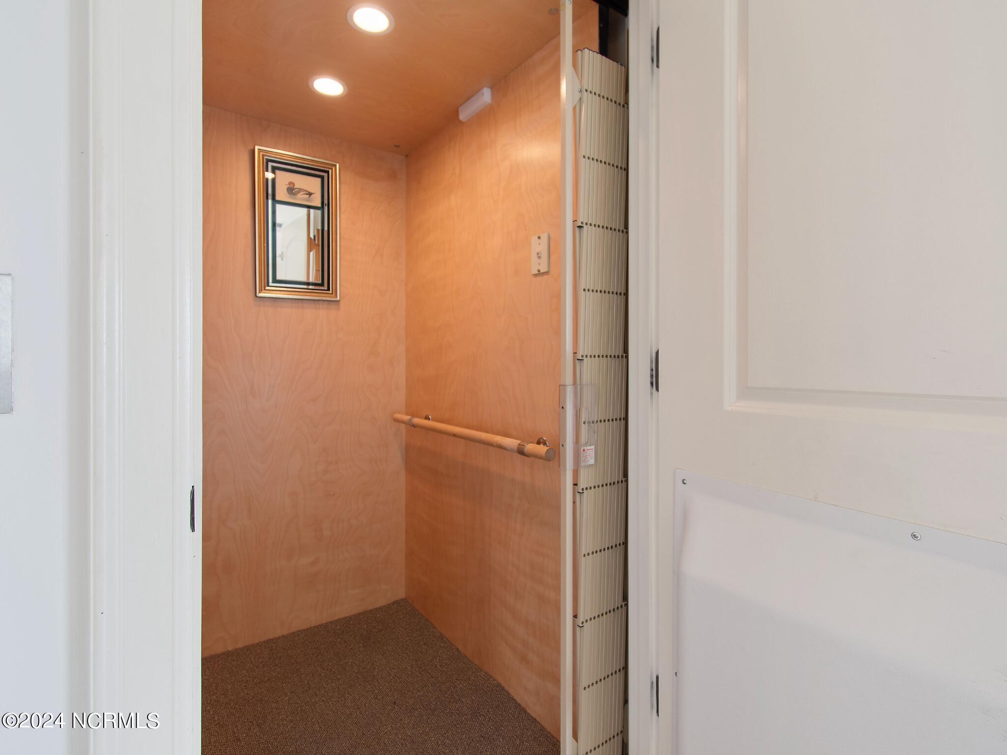 1906 Goose Creek Road Southwest, Unit 2 Ocean Isle Beach, NC 28469 - Photo 5 of 65 Elevator that services all 3 floors