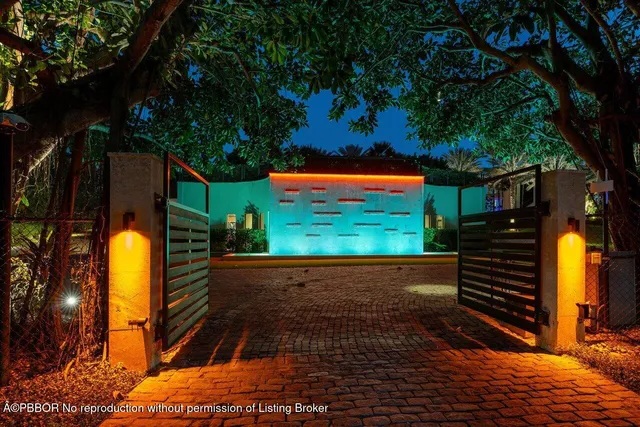 a front view of a house with a yard table and chairs