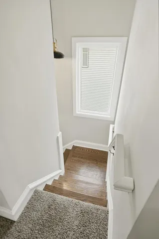 a view of entryway with wooden floor