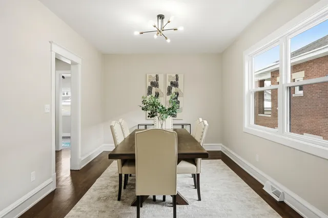 a view of a dining room with furniture window and wooden floor