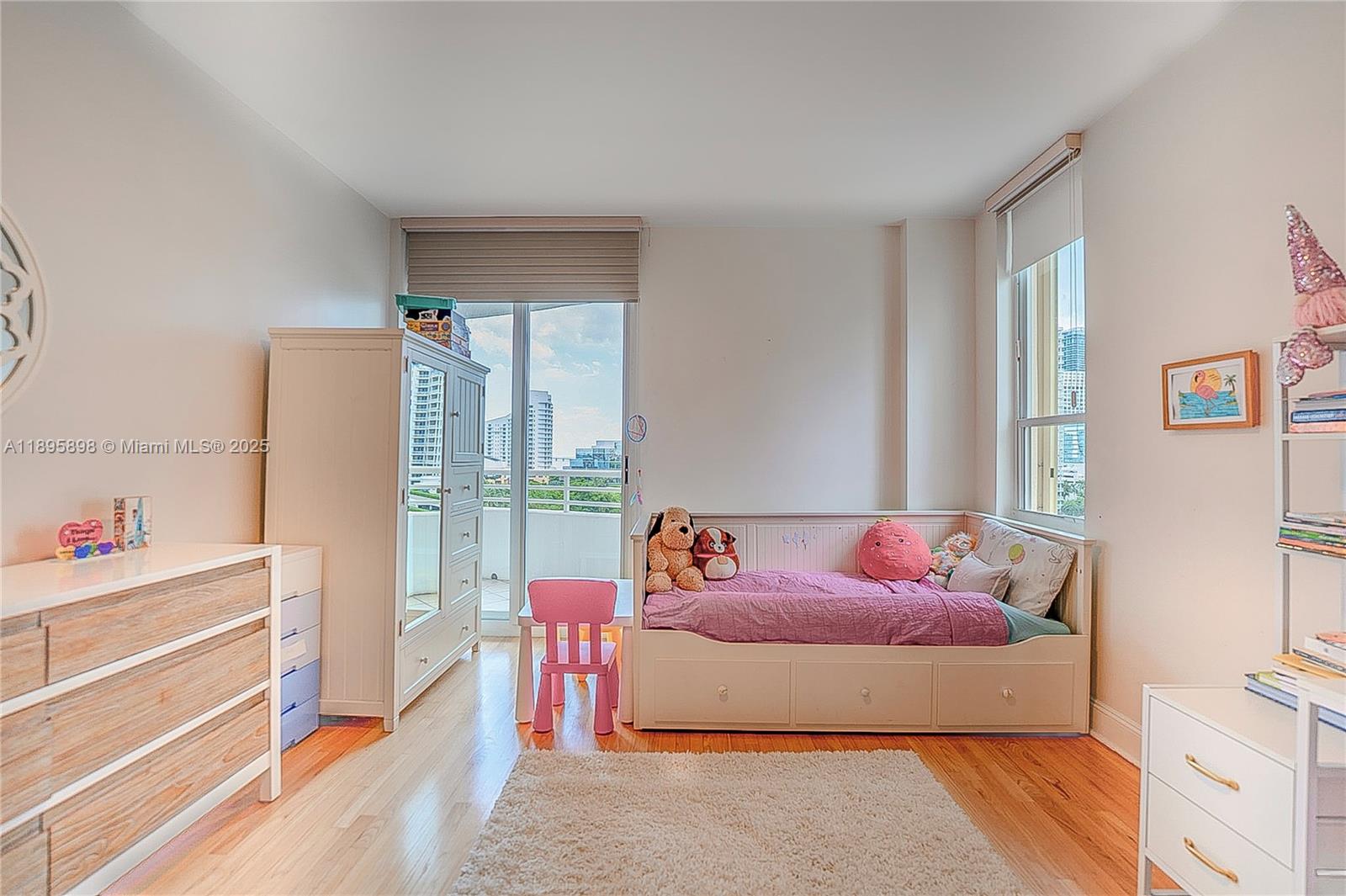 888 Brickell Key Drive, Unit 903 Miami, FL 33131 - Photo 14 of 38 a bedroom with a bed and a window