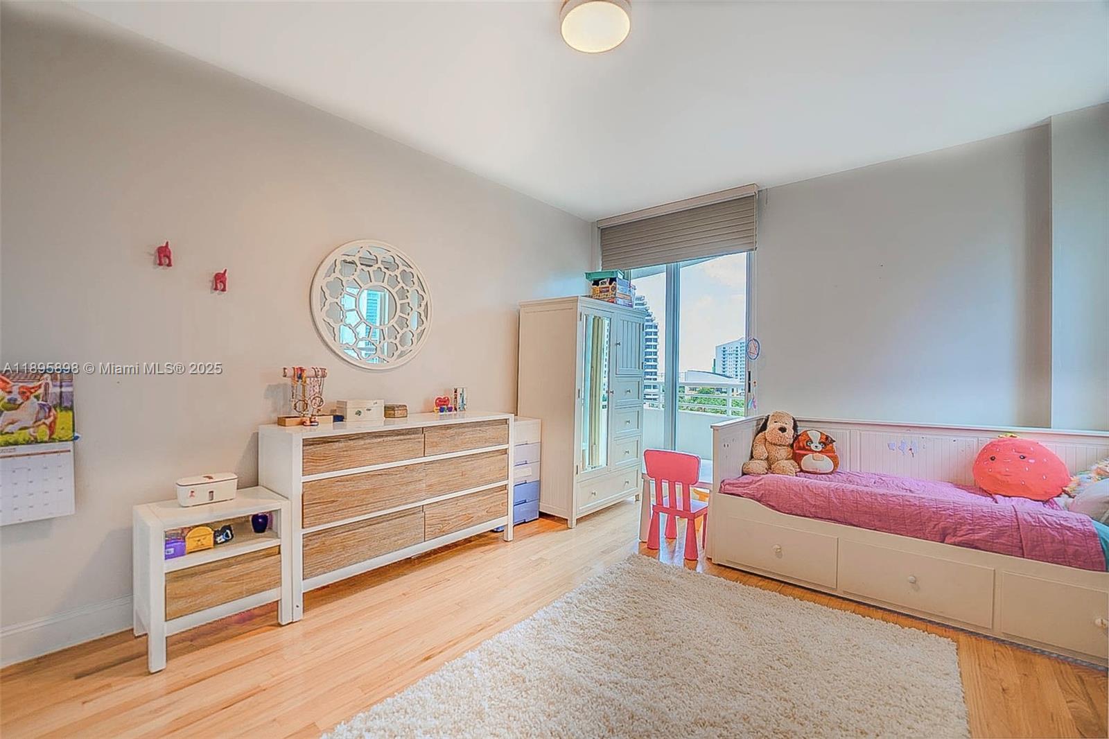 888 Brickell Key Drive, Unit 903 Miami, FL 33131 - Photo 15 of 38 a living room with furniture and a window
