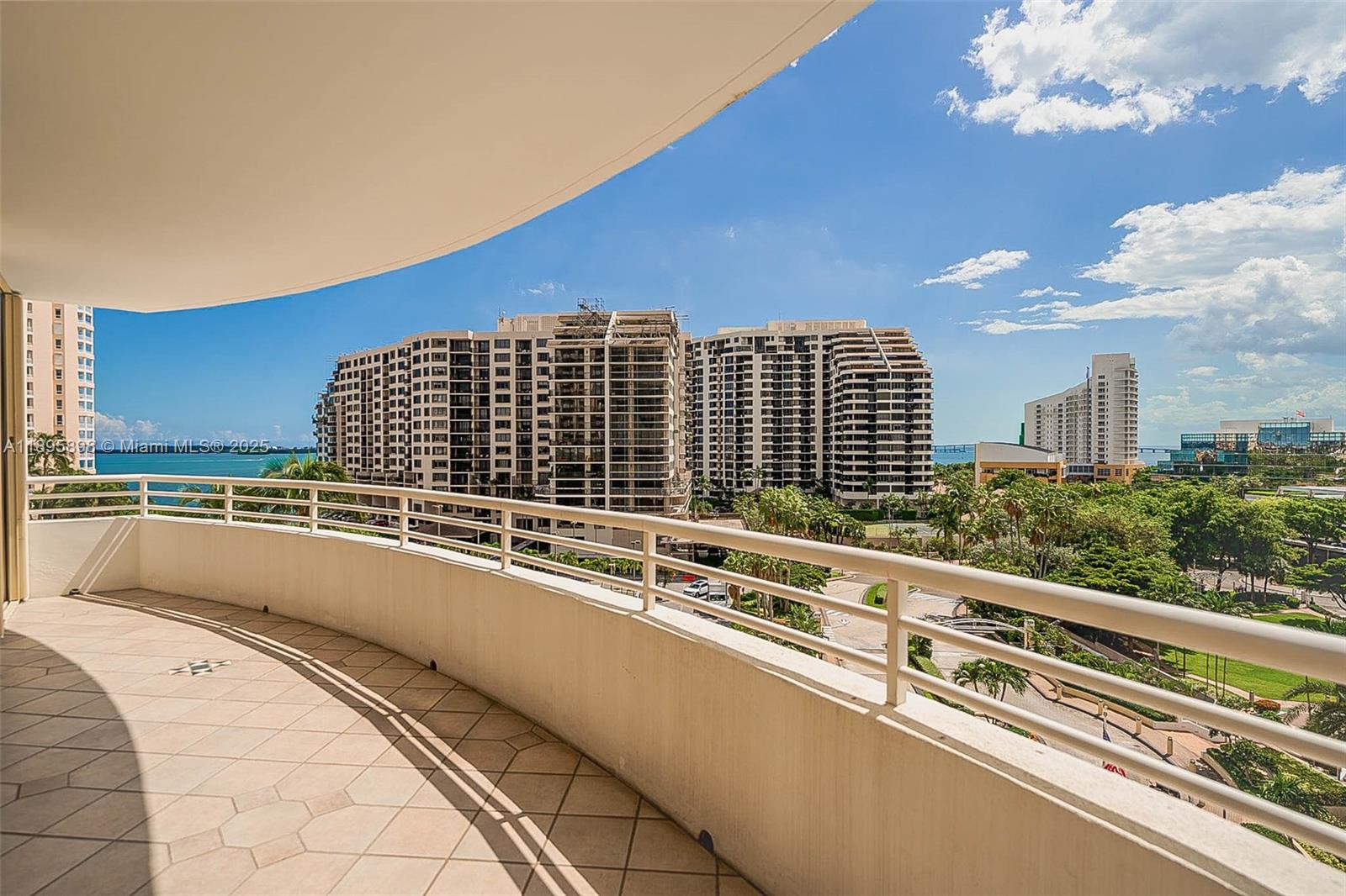 888 Brickell Key Drive, Unit 903 Miami, FL 33131 - Photo 21 of 38 a view of a balcony with an outdoor seating