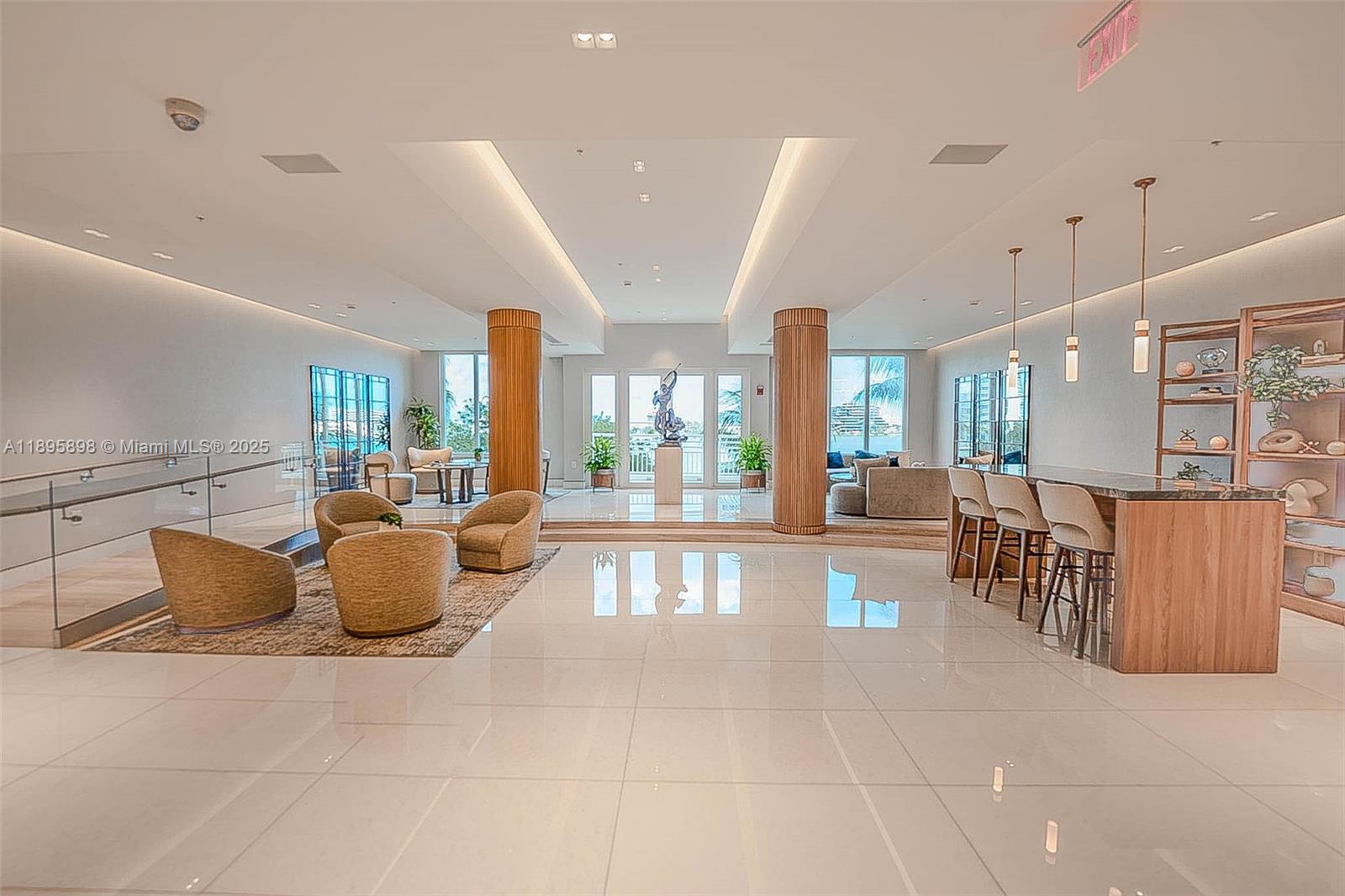 888 Brickell Key Drive, Unit 903 Miami, FL 33131 - Photo 24 of 38 a living room with furniture a large window and potted plants