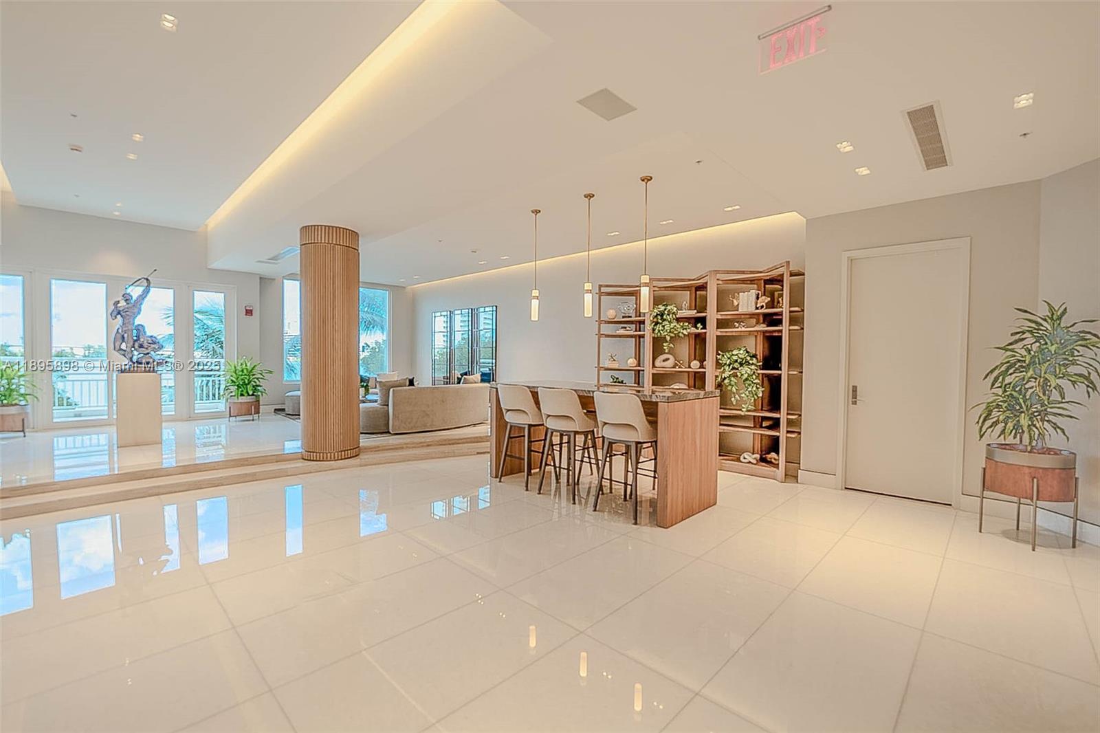 888 Brickell Key Drive, Unit 903 Miami, FL 33131 - Photo 25 of 38 a view of a an empty room with furniture and a large window