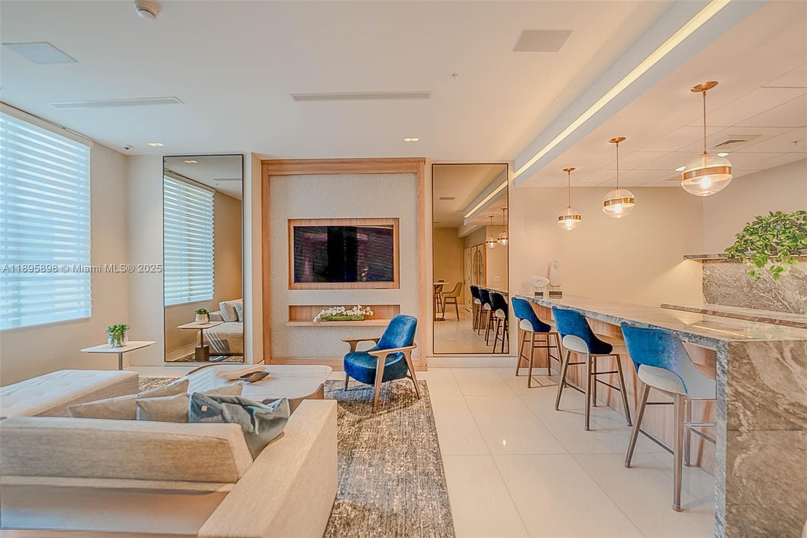 888 Brickell Key Drive, Unit 903 Miami, FL 33131 - Photo 26 of 38 a living room with furniture and a flat screen tv