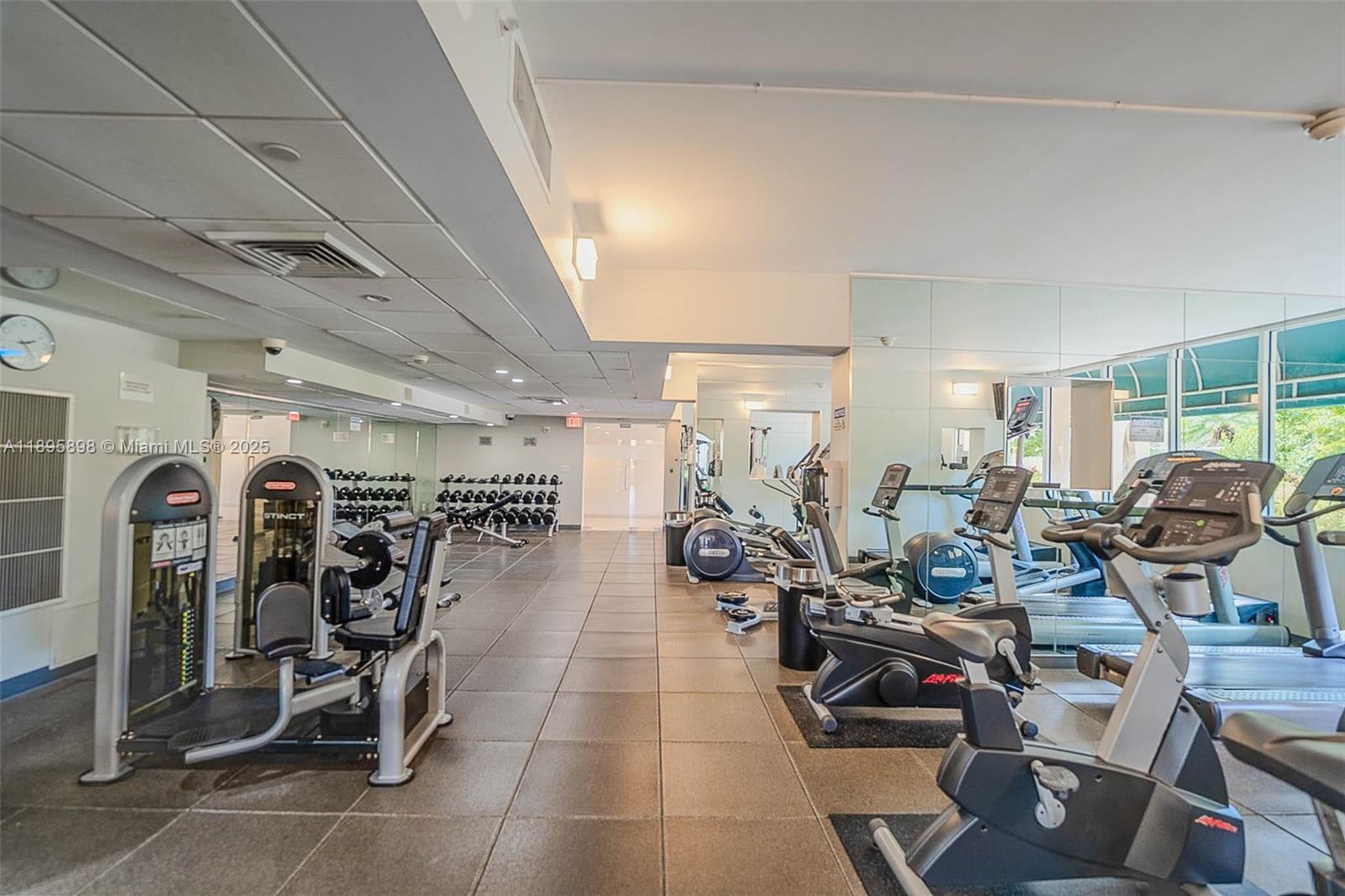 888 Brickell Key Drive, Unit 903 Miami, FL 33131 - Photo 30 of 38 a view of a room with gym equipment