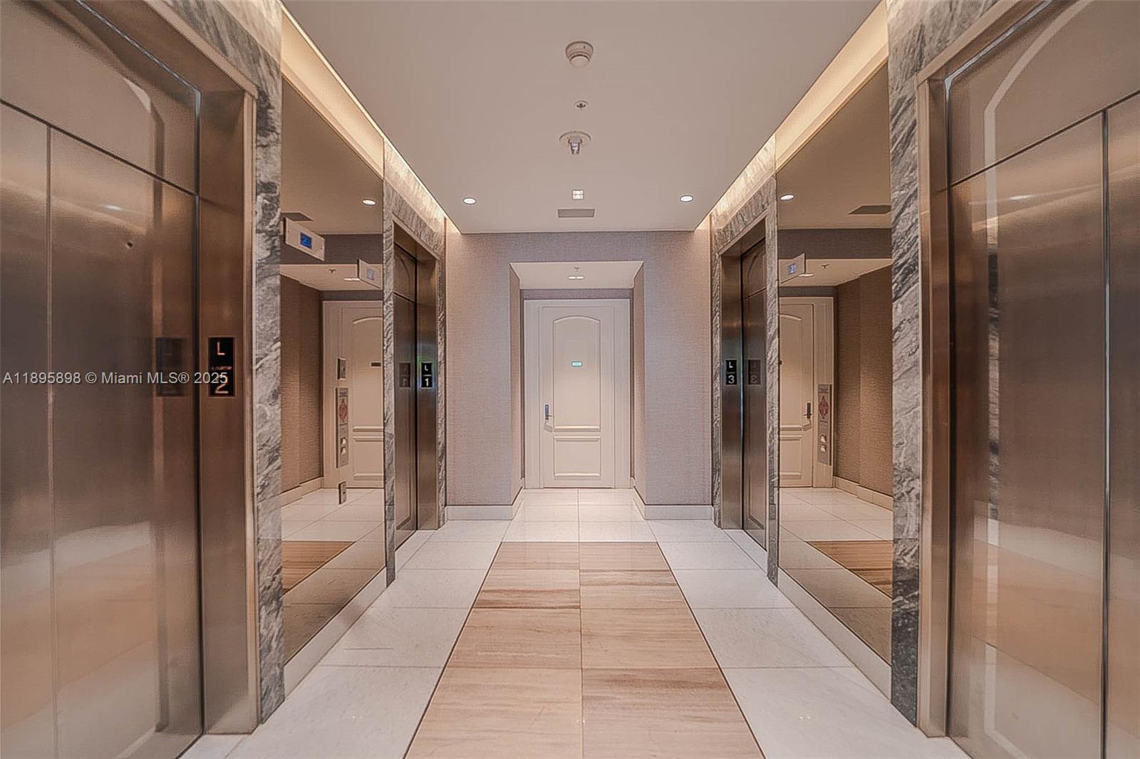 888 Brickell Key Drive, Unit 903 Miami, FL 33131 - Photo 31 of 38 a bathroom with a glass shower door