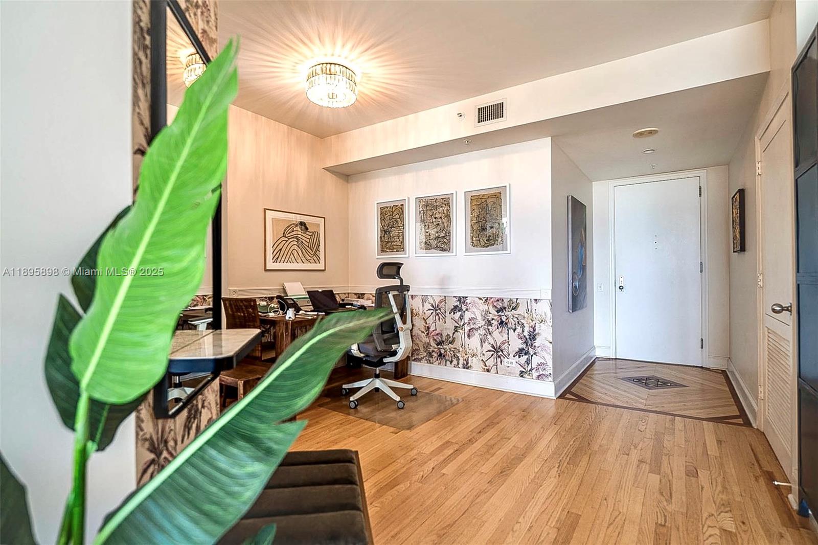 888 Brickell Key Drive, Unit 903 Miami, FL 33131 - Photo 7 of 38 a room with lots of trees and a wooden floor