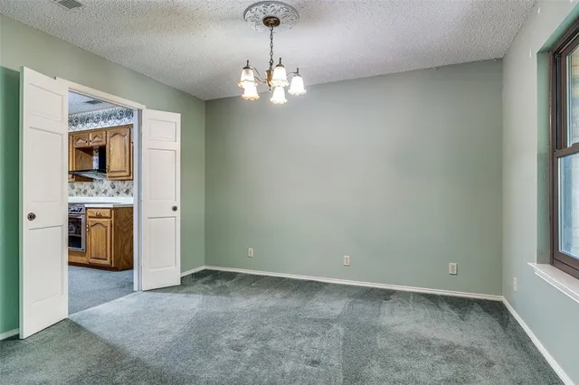 a view of a kitchen with a sink cabinets and a window
