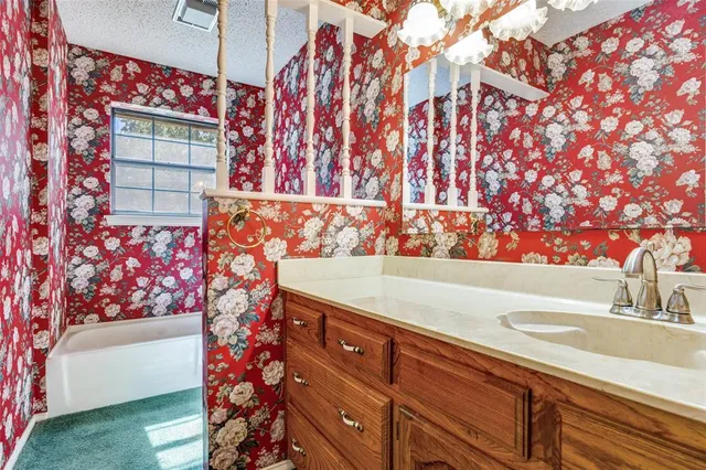 a bathroom with a sink and a bathtub