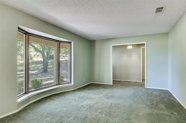 wooden floor and window in an empty room