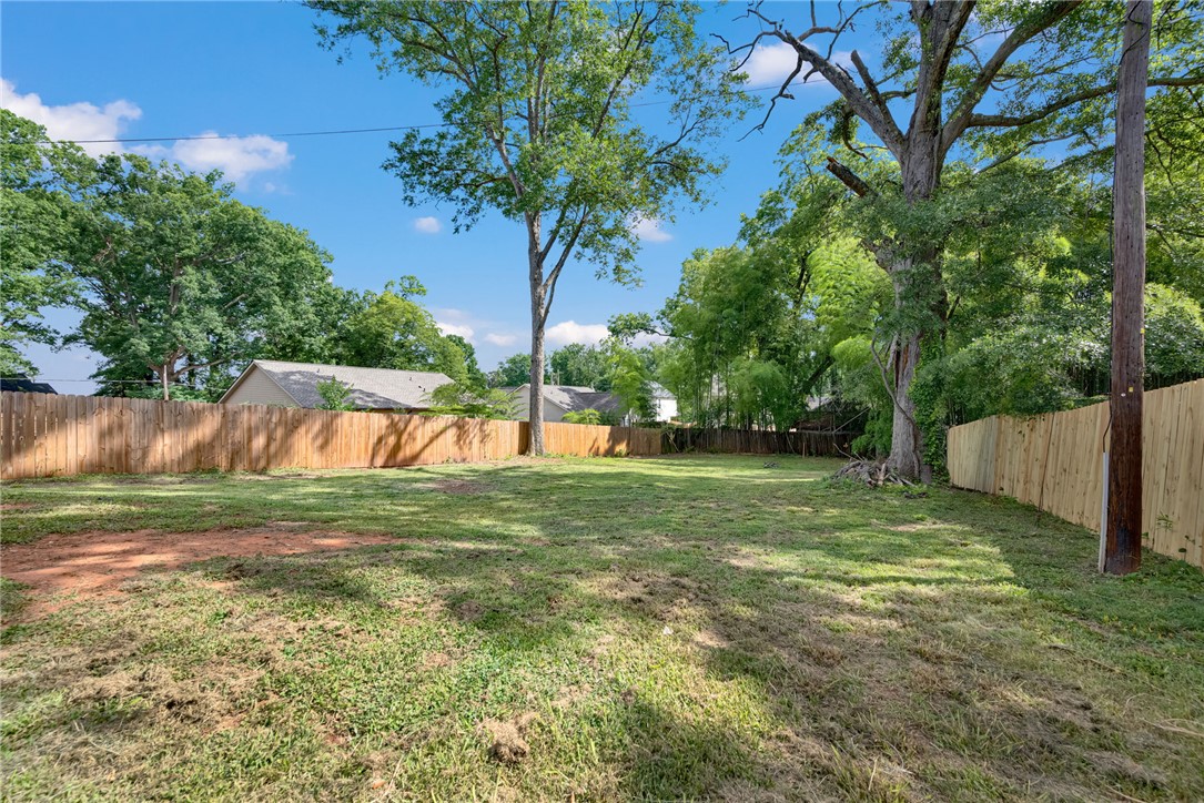 1020 Elizabeth Street Anderson, SC 29624 - Photo 18 of 22 Secure yard featuring a new wooden fence and mature trees for natural shade.