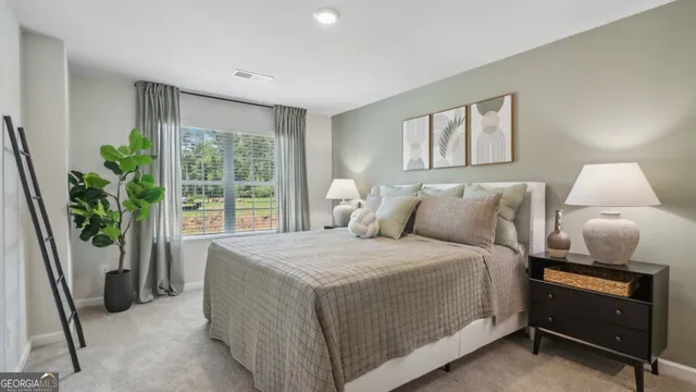 a bedroom with a bed and a window