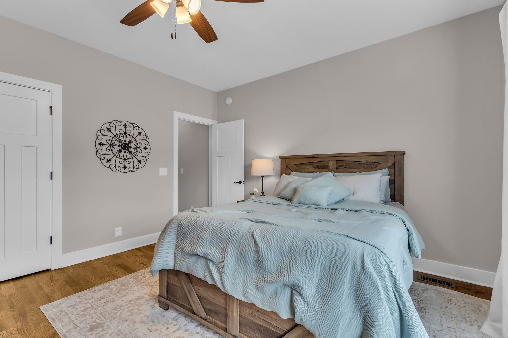 7816 Brenda Lane Murfreesboro, TN 37129 - Photo 17 of 53 a bedroom with a large bed and a chandelier