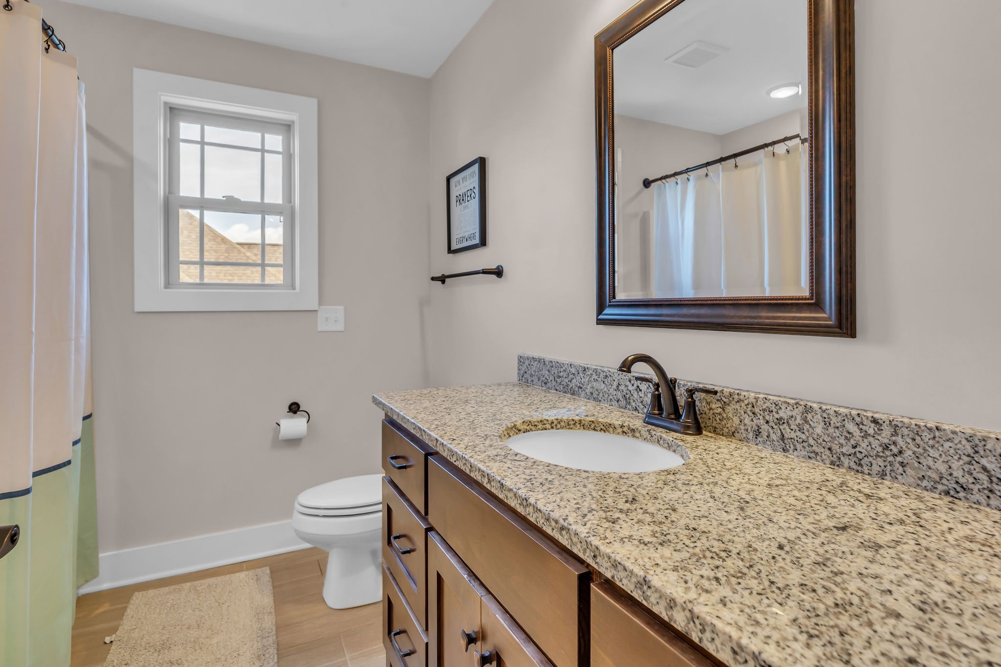 7816 Brenda Lane Murfreesboro, TN 37129 - Photo 40 of 53 a bathroom with a granite countertop sink and a toilet