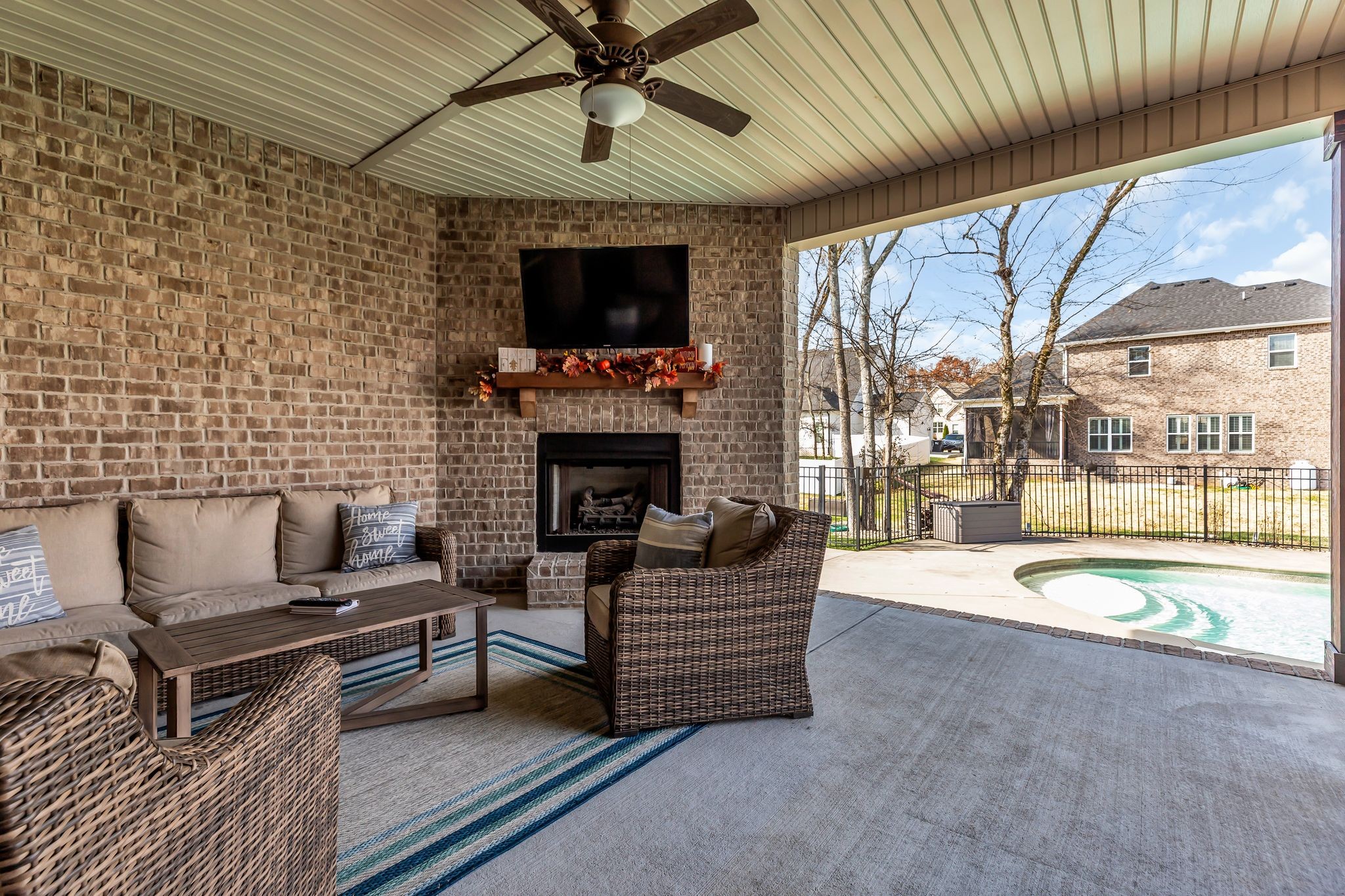 7816 Brenda Lane Murfreesboro, TN 37129 - Photo 48 of 53 a living room with furniture a flat screen tv and a fireplace