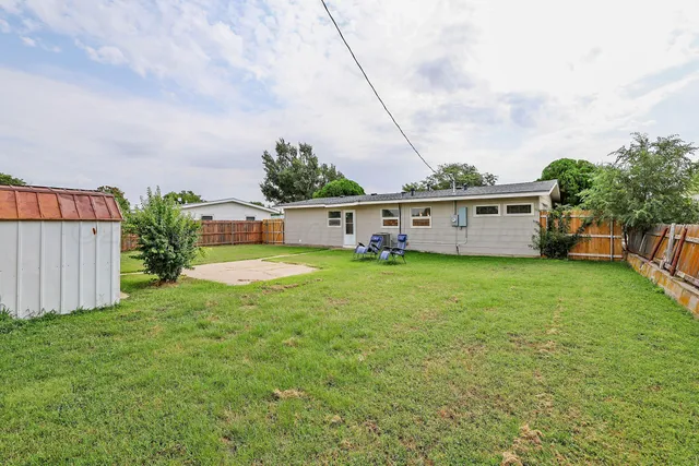 a kitchen with refrigerator and window