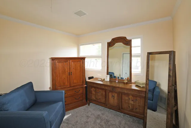 a view of a room with wooden floor and white walls
