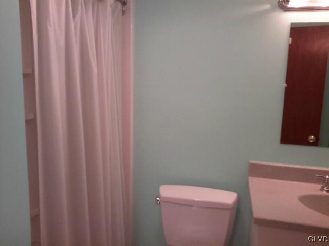 38 Ridgewood Road Easton, PA 18045 - Photo 25 of 33 a white toilet sitting next to a shower curtain