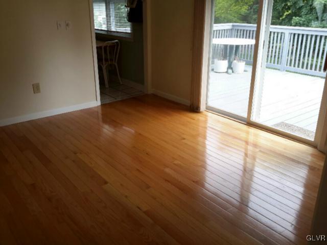38 Ridgewood Road Easton, PA 18045 - Photo 7 of 33 a view of an empty room with wooden floor and windows