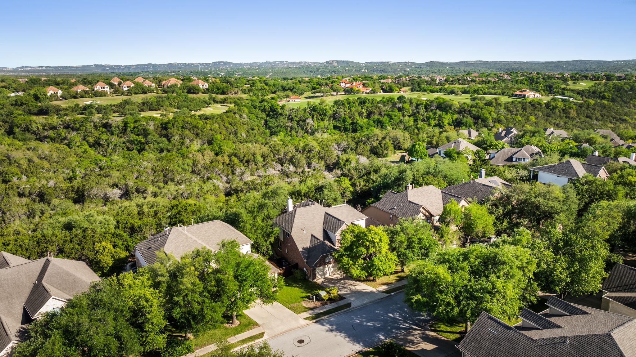 2708 Rio Mesa Drive Austin, TX 78732 - Photo 32 of 40 an aerial view of residential houses with outdoor space and trees