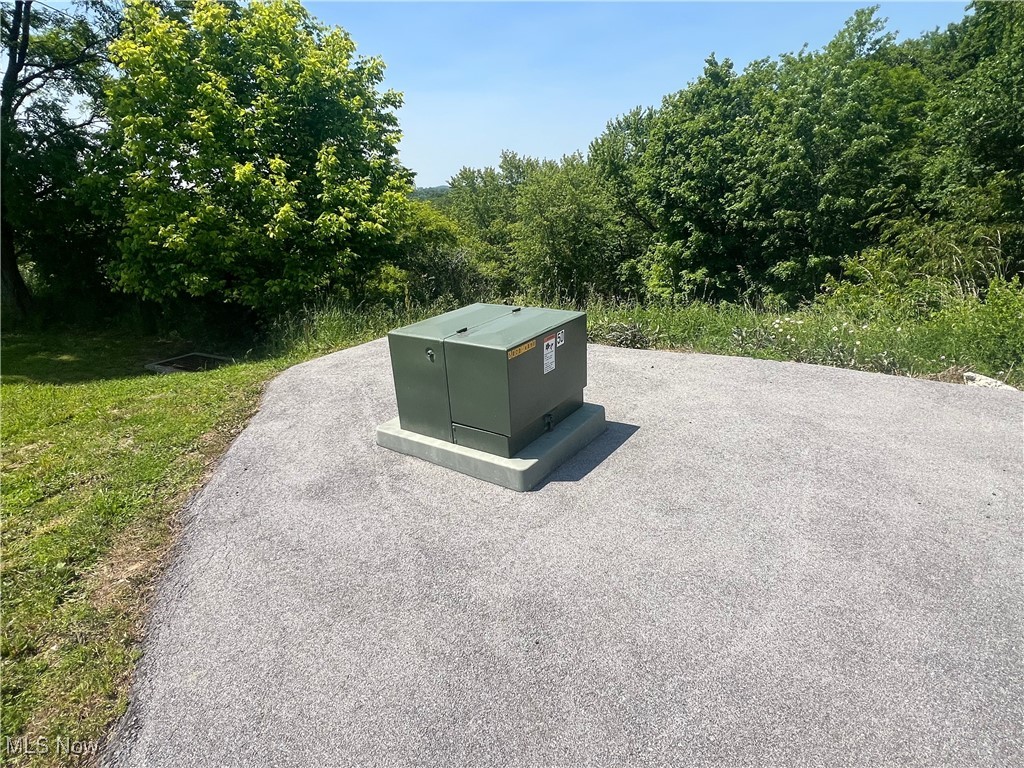 Tbd Fort Henry Road Triadelphia, WV 26059 - Photo 14 of 15 Exterior view of a pad mount transformer and a heavily wooded area