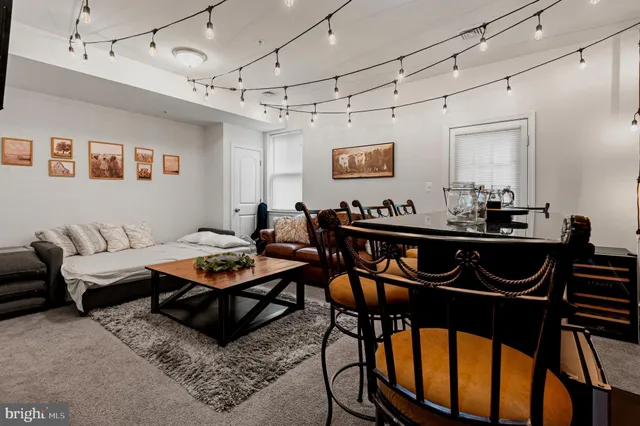 a living room with furniture and a table
