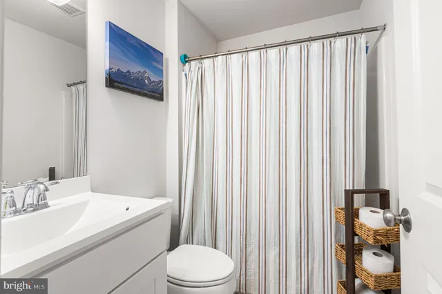 a bathroom with a sink a vanity and a mirror