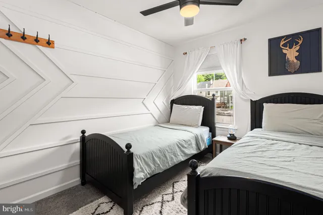 a bathroom with a sink a toilet and shower curtain