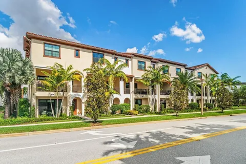 a view of a building with a yard