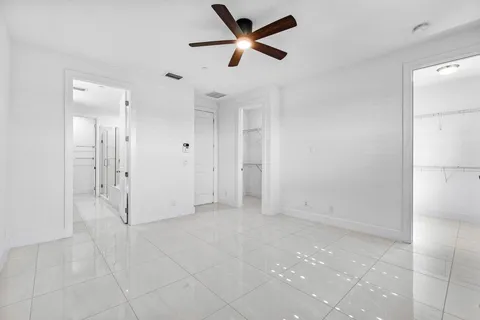 a bathroom with a sink double vanity and a mirror
