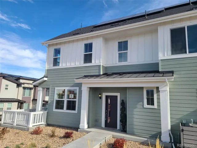 a view of a house with a roof deck