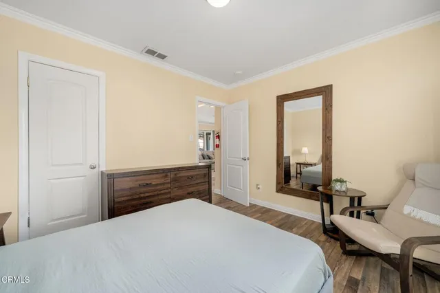 a bedroom with a bed and furniture