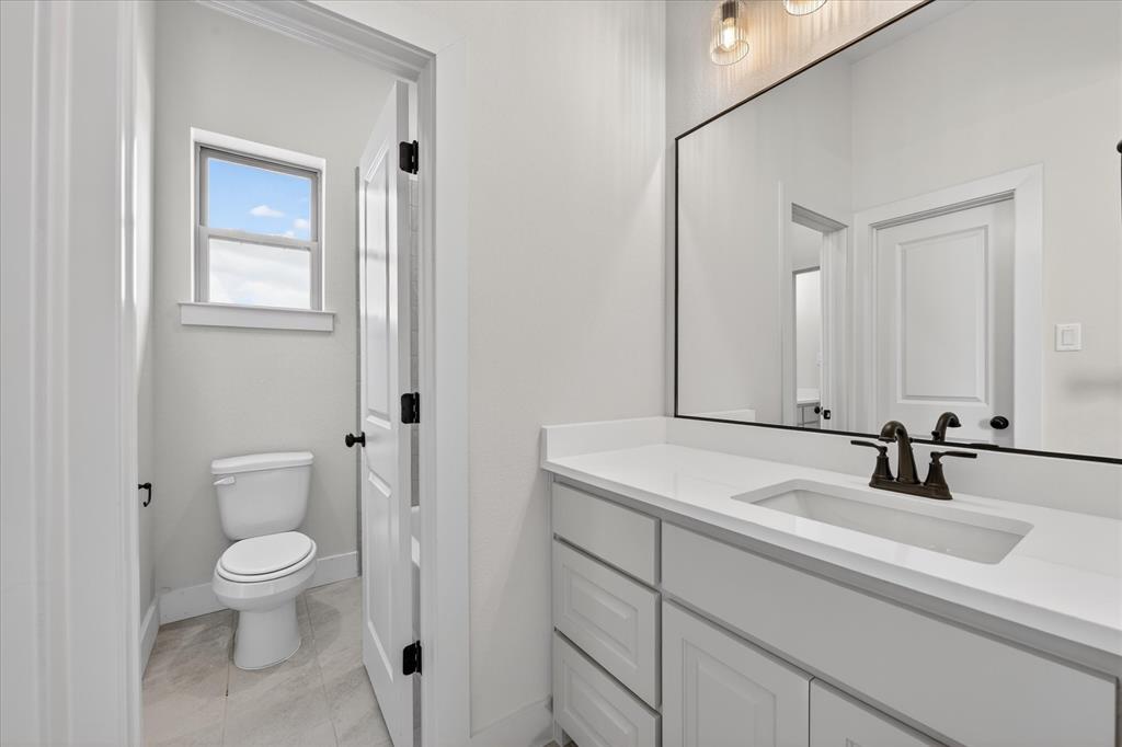 517 Longhorn Lane Springtown, TX 76082 - Photo 27 of 39 Bathroom featuring toilet and vanity