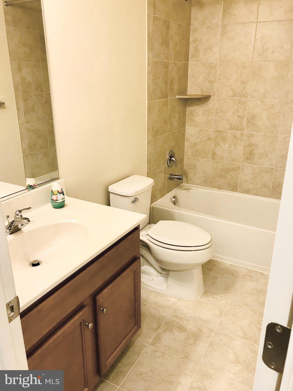 4713 Cambria Road Frederick, MD 21703 - Photo 21 of 67 a bathroom with a sink a toilet and shower