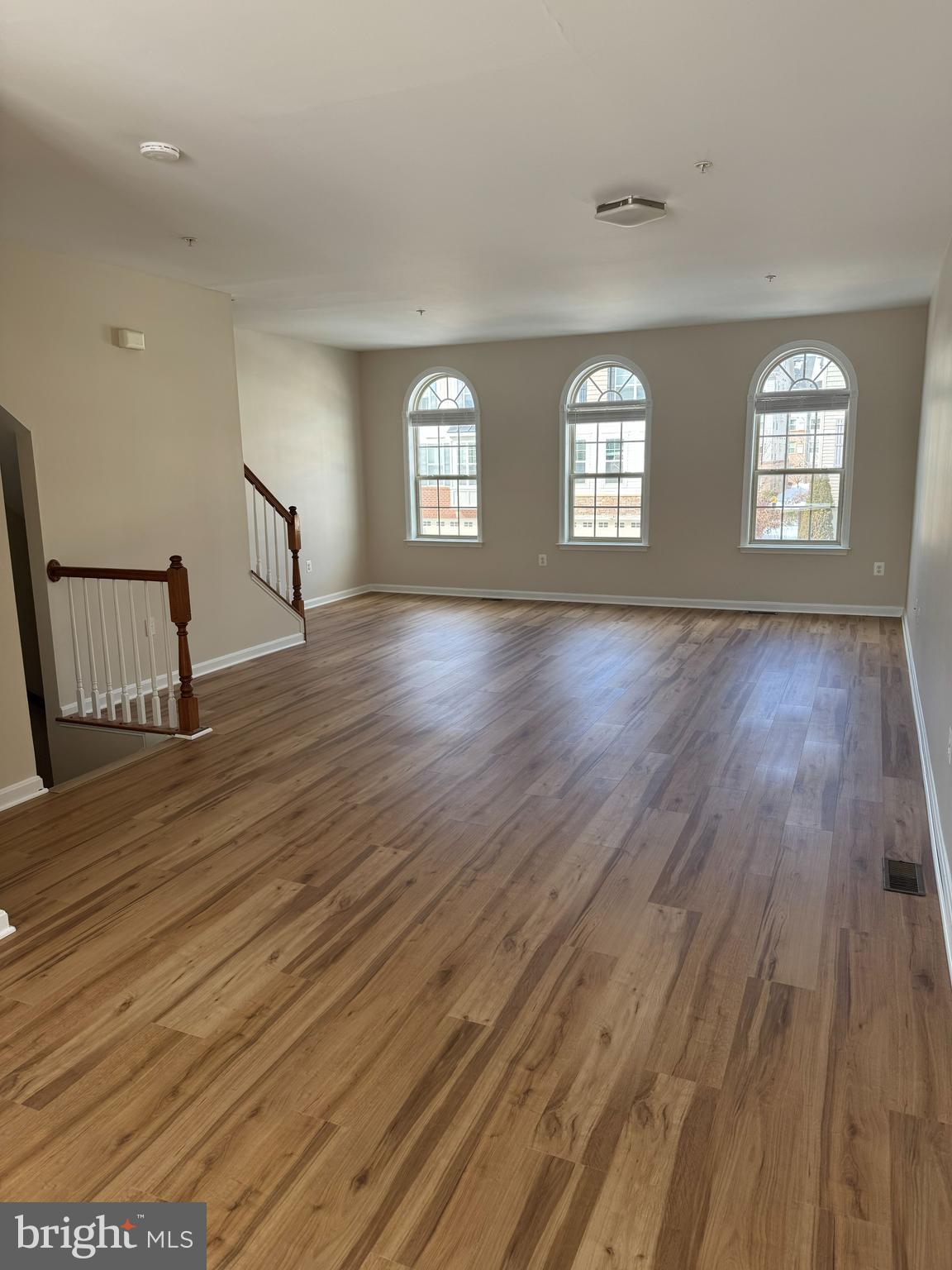 4713 Cambria Road Frederick, MD 21703 - Photo 35 of 67 an empty room with wooden floor and windows