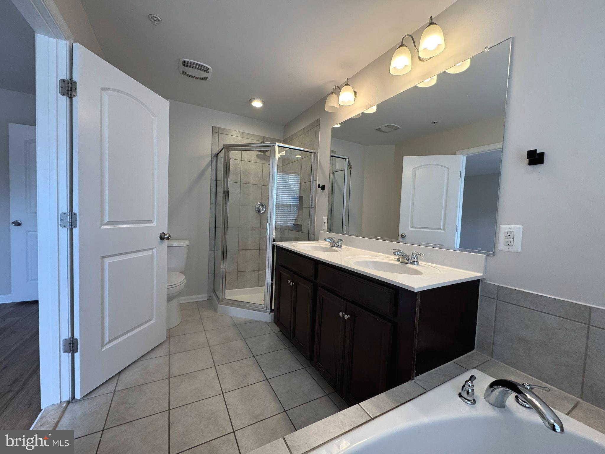 4713 Cambria Road Frederick, MD 21703 - Photo 48 of 67 a bathroom with a sink vanity and a mirror