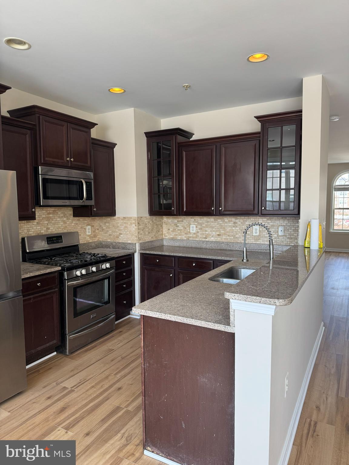 4713 Cambria Road Frederick, MD 21703 - Photo 6 of 67 a kitchen with stainless steel appliances granite countertop a sink stove and refrigerator
