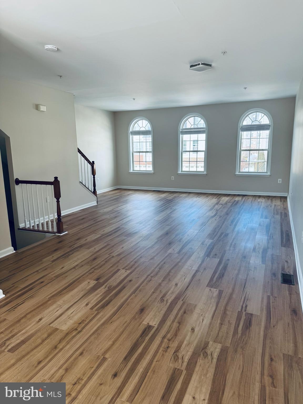 4713 Cambria Road Frederick, MD 21703 - Photo 67 of 67 an empty room with wooden floor and windows