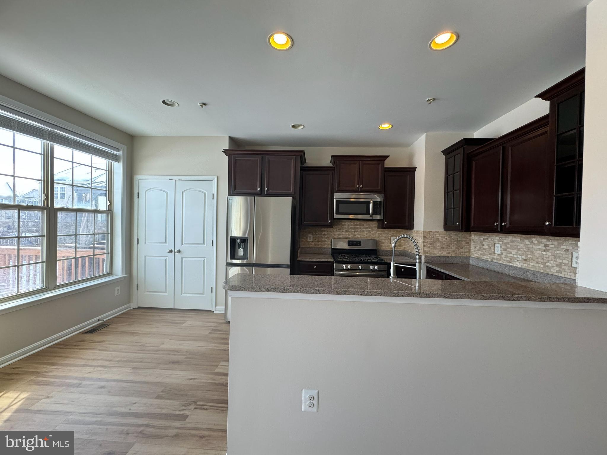 4713 Cambria Road Frederick, MD 21703 - Photo 9 of 67 a kitchen with stainless steel appliances a refrigerator and a sink