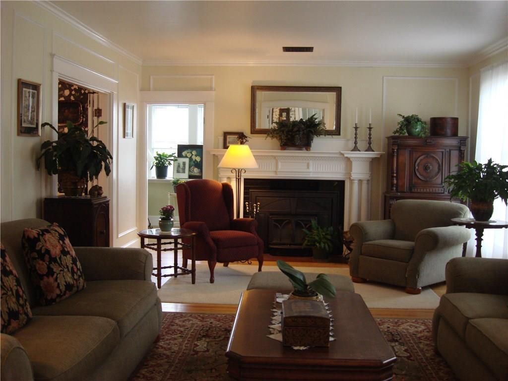 123 Winthrop Street Augusta, ME 04330 - Photo 11 of 35 Living room with a cozy wood burning...