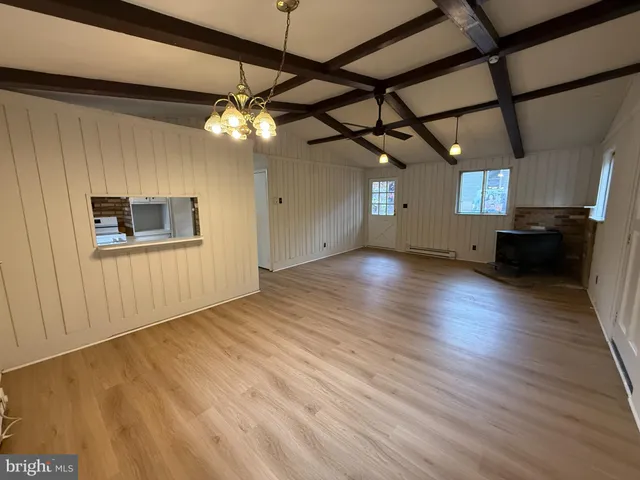 a view of a livingroom with wooden floor