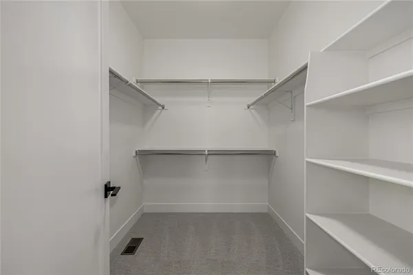 a view of an empty walk in closet