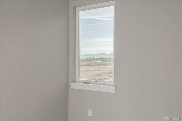 a view of a window in an empty room