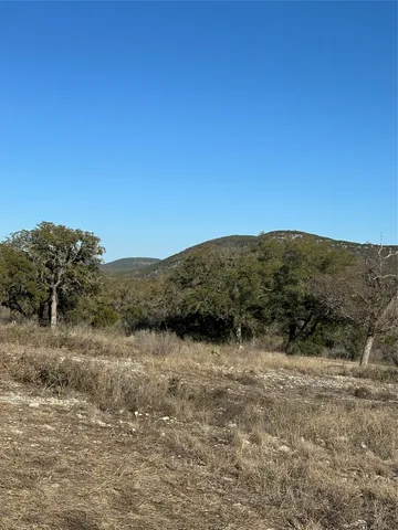 a view of a dry yard with mountain