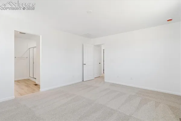 a bathroom with a double vanity sink and mirror with shower
